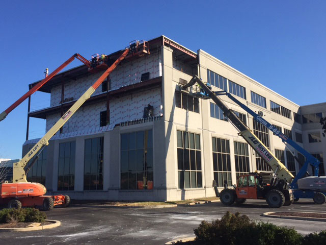 Lifts in operation at an active construction site