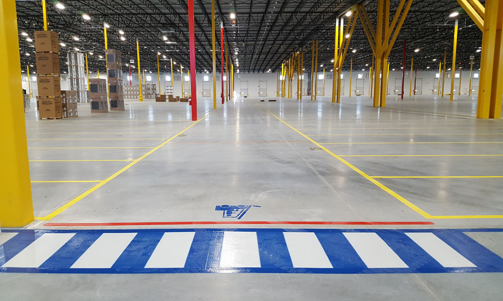 Warehouse interior with forklift paths