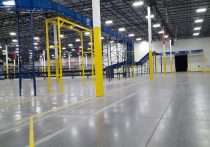 Alternate view of Geodis automated warehouse with conveyors and rack systems