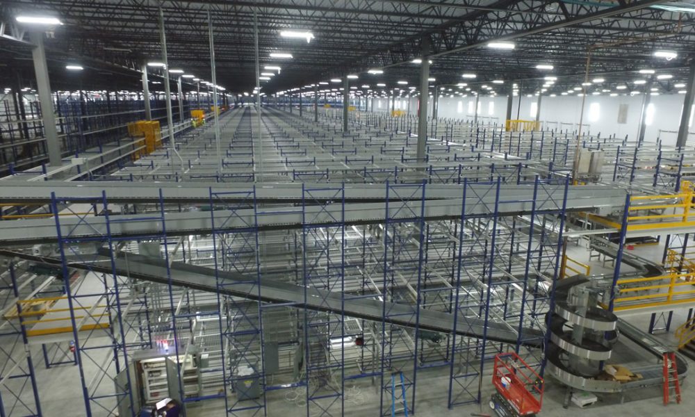 interior of liberty warehouse with conveyor lines and storage racks