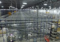 interior of liberty warehouse with conveyor lines and storage racks