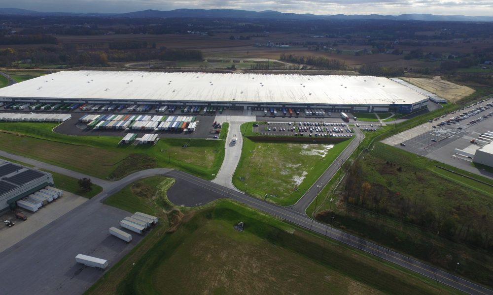 warehouse aerial with surrounding roads and countryside
