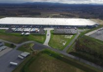 warehouse aerial with surrounding roads and countryside