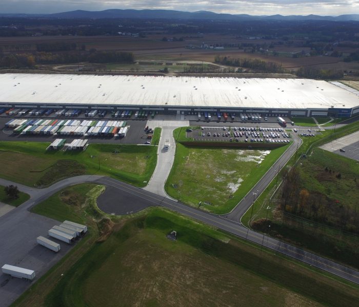 warehouse aerial with surrounding roads and countryside