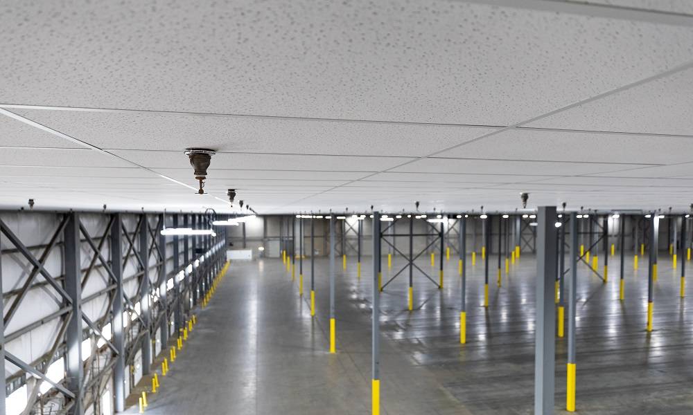 closeup of warehouse drop ceiling with sprinkler