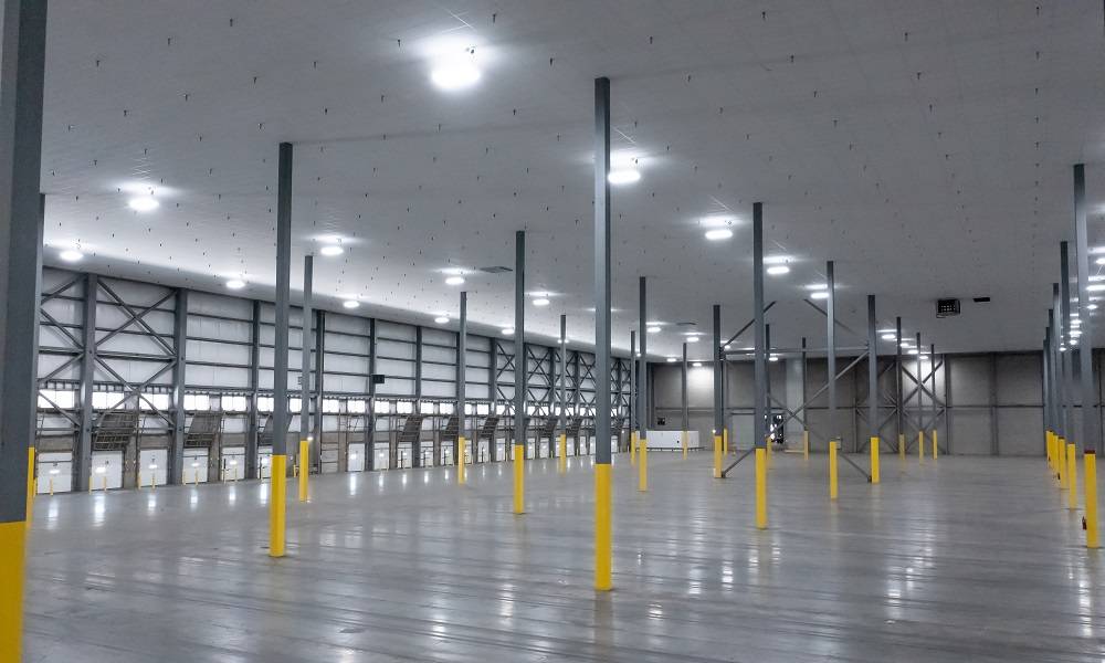 lit warehouse interior with large drop ceiling