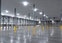 lit warehouse interior with large drop ceiling