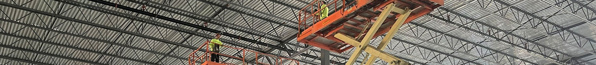 2 construction workers working in warehouse