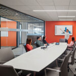 conference room with people reviewing a presentation