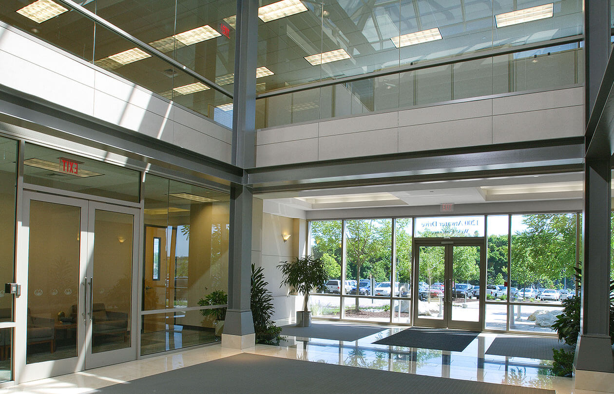main lobby area of office building with large windows
