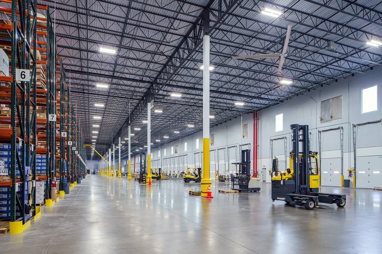 Warehouse interior view with forklifts
