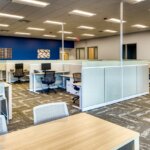 Office cubicles with chairs and desks