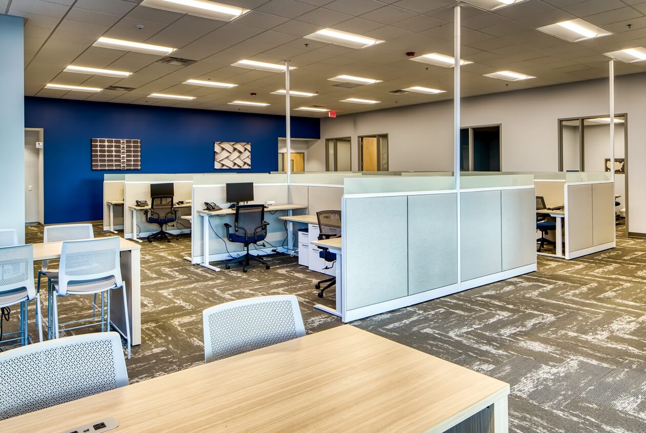 Office cubicles with chairs and desks