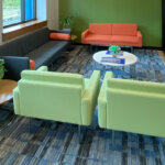 office seating area with brightly colored chairs