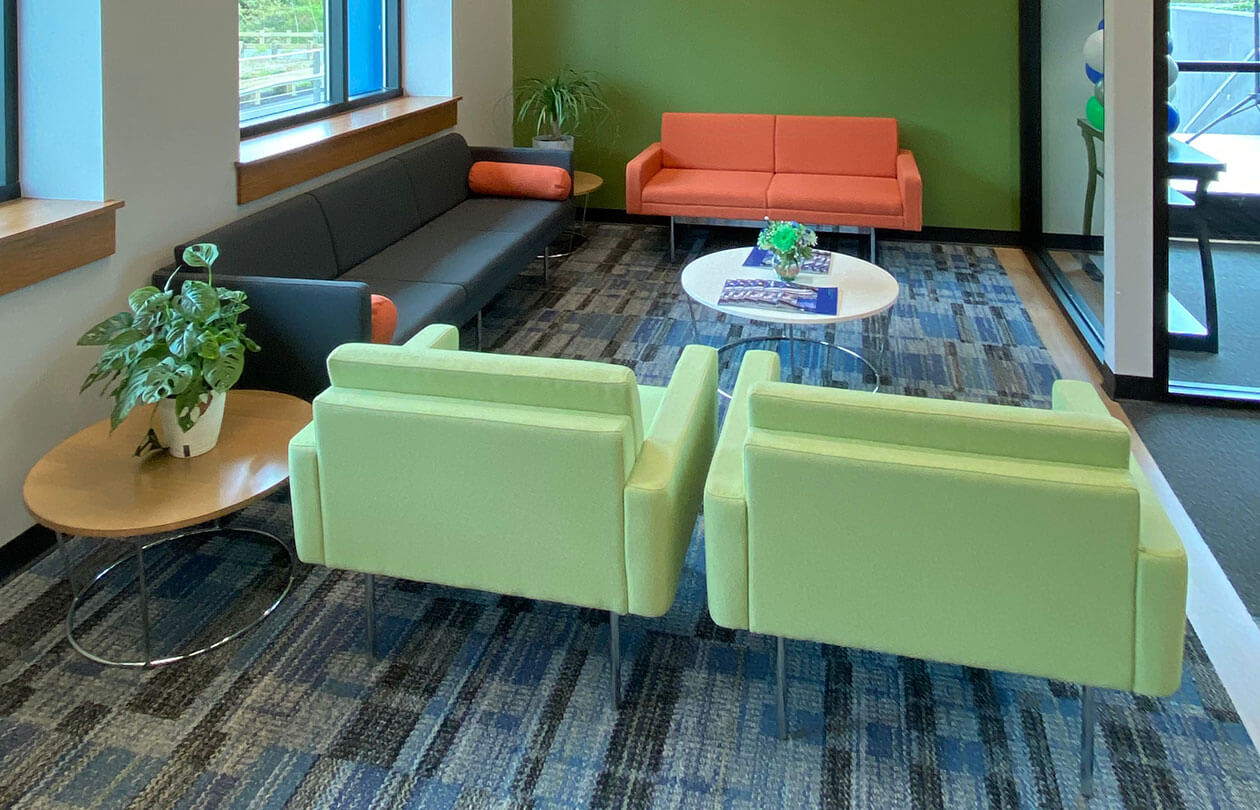 office seating area with brightly colored chairs