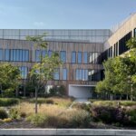Iovance building exterior side courtyard with trees