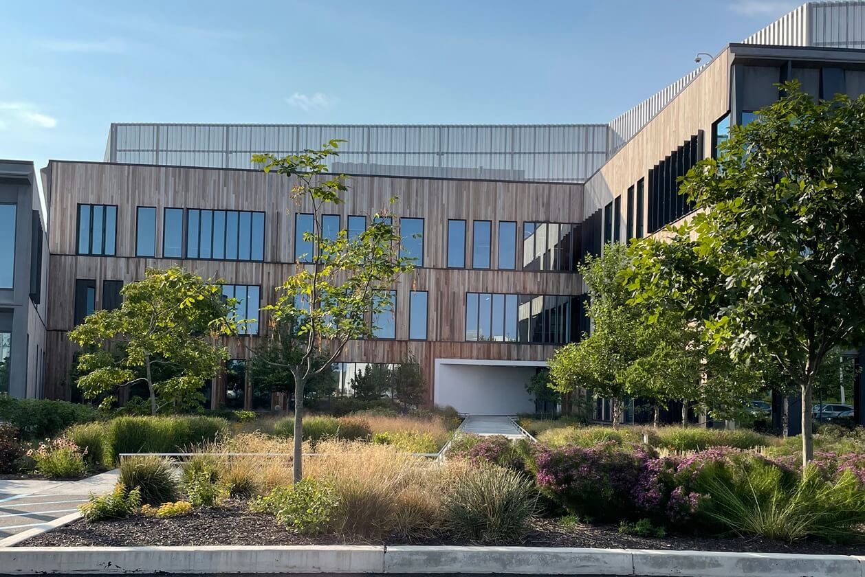 Iovance building exterior side courtyard with trees