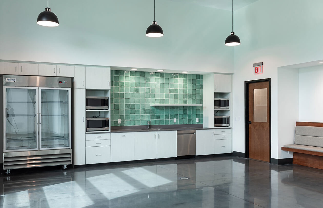 interior commercial kitchen and break room view with appliances