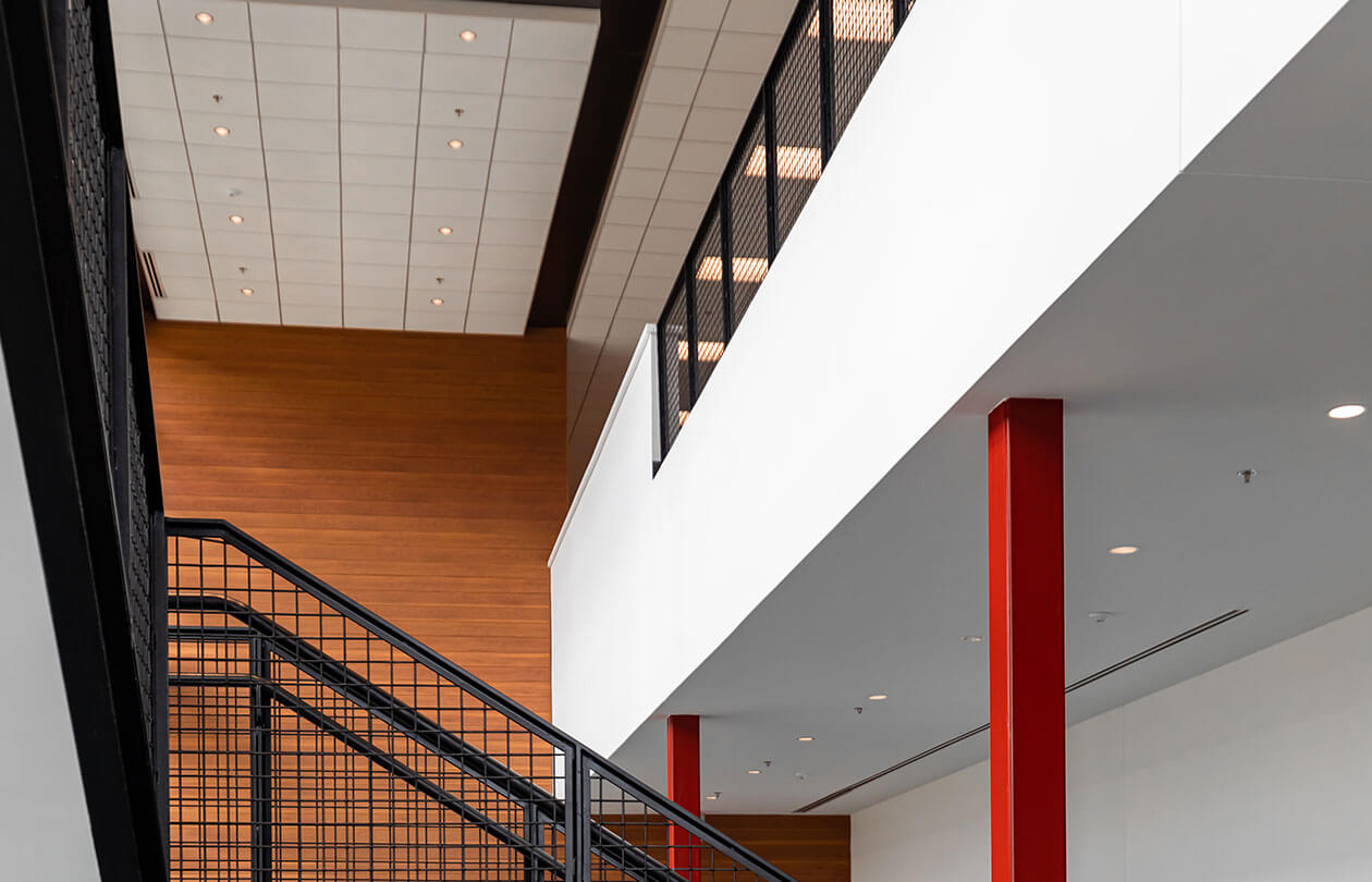 view of upper level in building and stairs