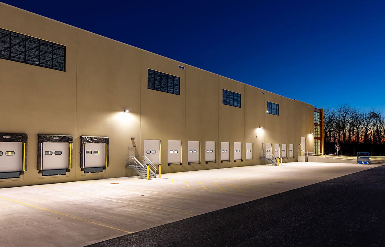 night view of warehouse side view with dock doors