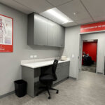 Doctor's office view with chair and desk that looks into the hallway