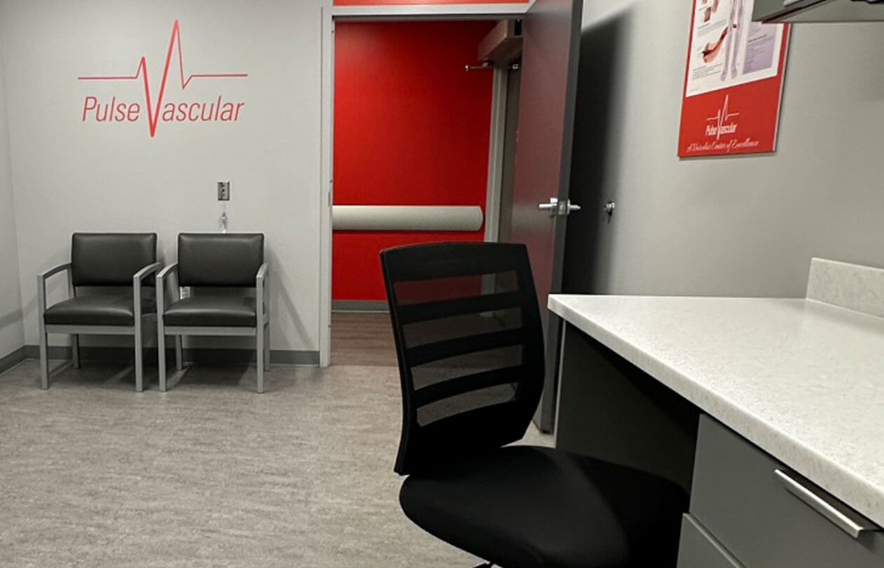 medical office room with chairs and a desk