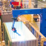 robotic welding machine working inside a container