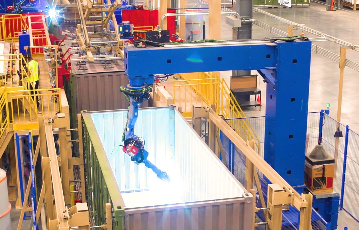 robotic welding machine working inside a container