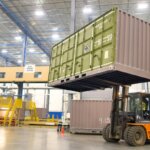 equipment lifting a large container box