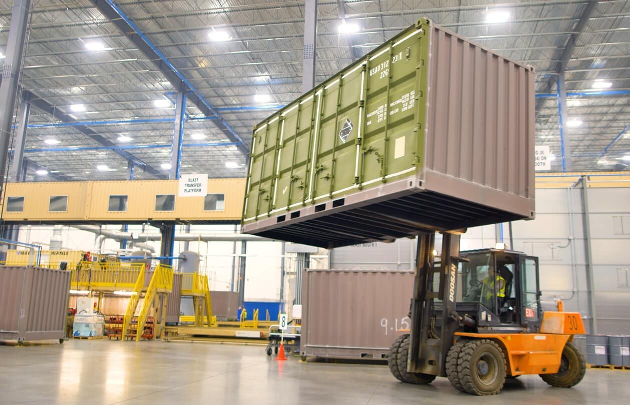 equipment lifting a large container box