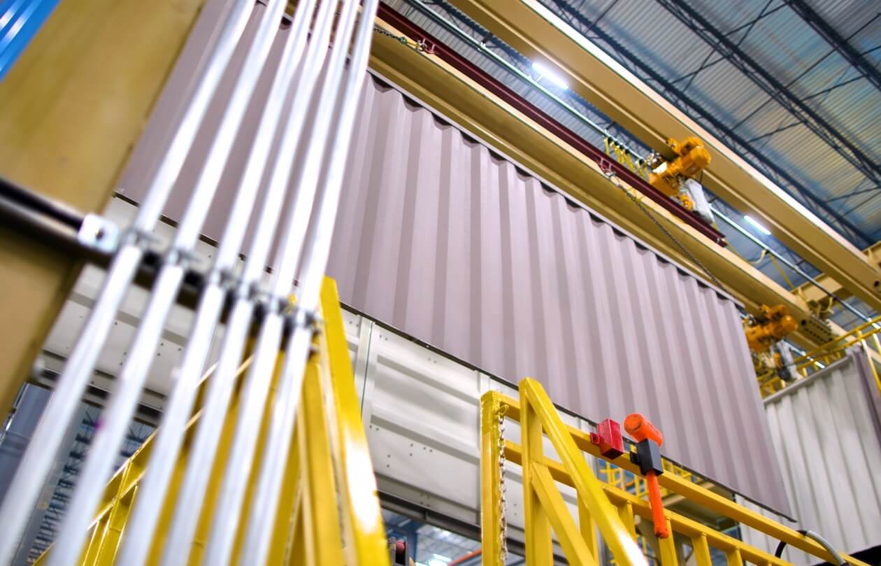 view looking up at large containers on production floor