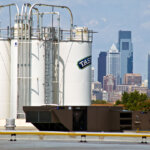 tastykake silos with city view in background