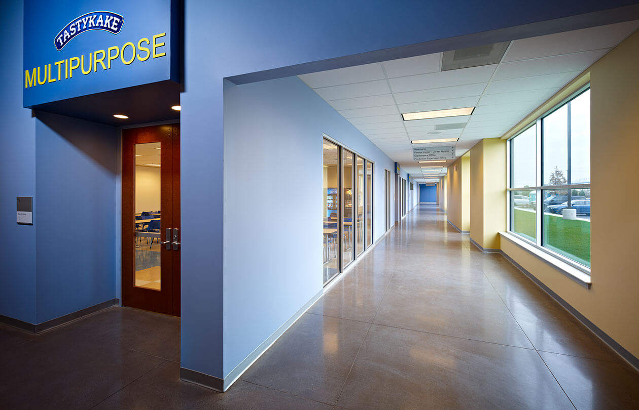 long hallway with blue walls