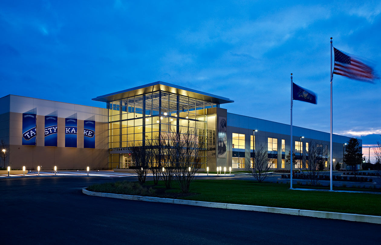 exterior of tastykake facility at night lit up