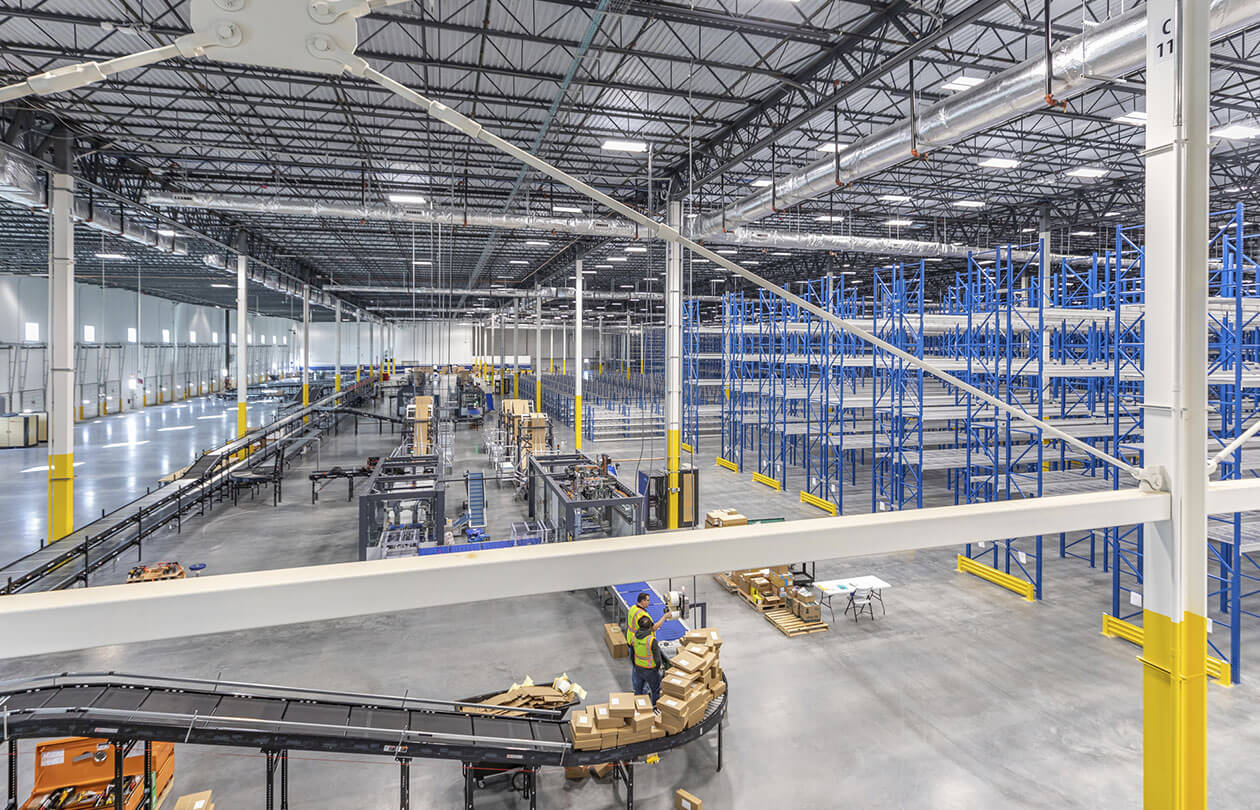 warehouse racking and conveyors through steel beams
