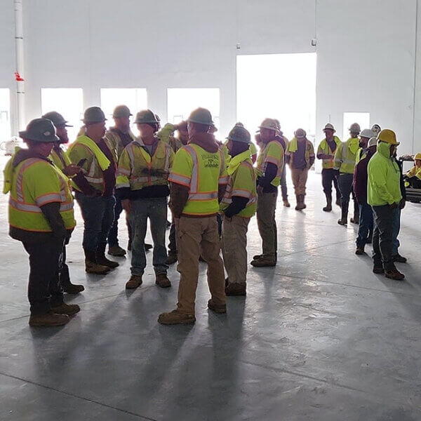 group of penntex field employees conversing together photo bar jpg
