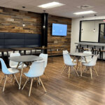 modern interior office gathering space with tables and chairs
