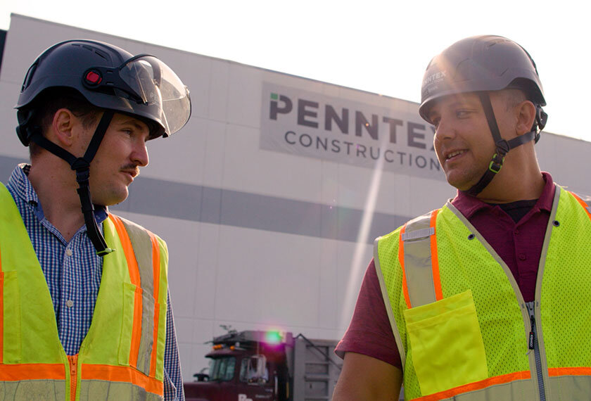 penntex team members talking to each other with hard hats
