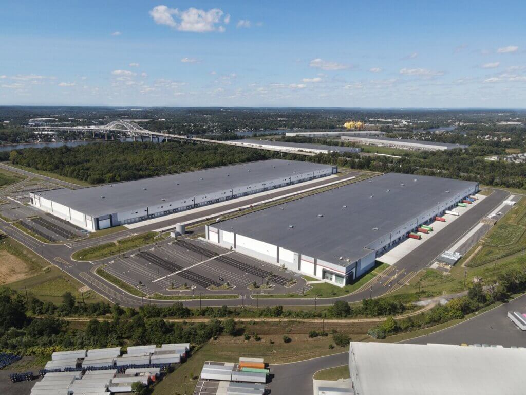 wide shot aerial view of two warehouse facilities side by side