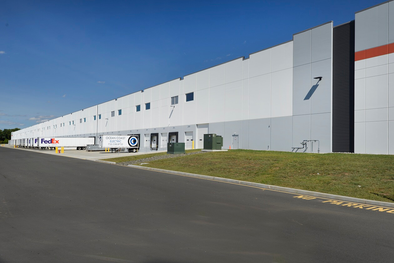 back of warehouse view of docks with trucks