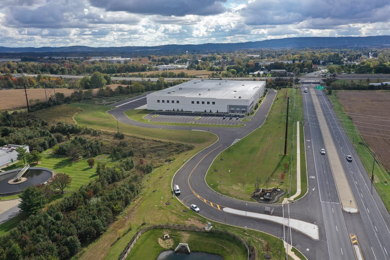 exterior aerial view of warehouse facility with roads around it