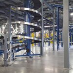 Interior production facility with conveyors and racking