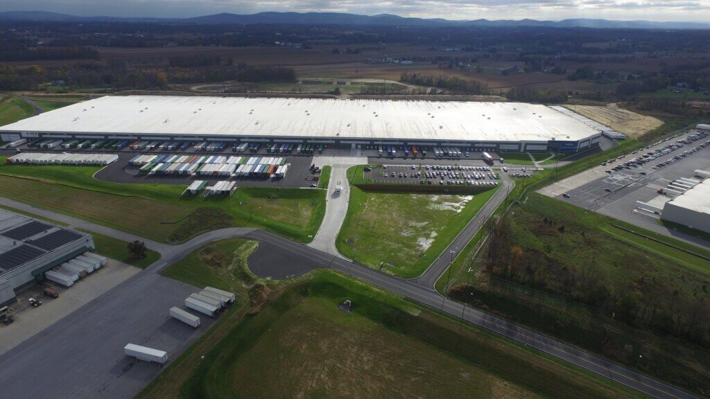 wide view of drone shot of large exterior warehouse facility