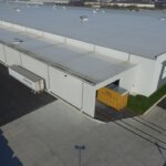 warehouse with train tracks leading into facility