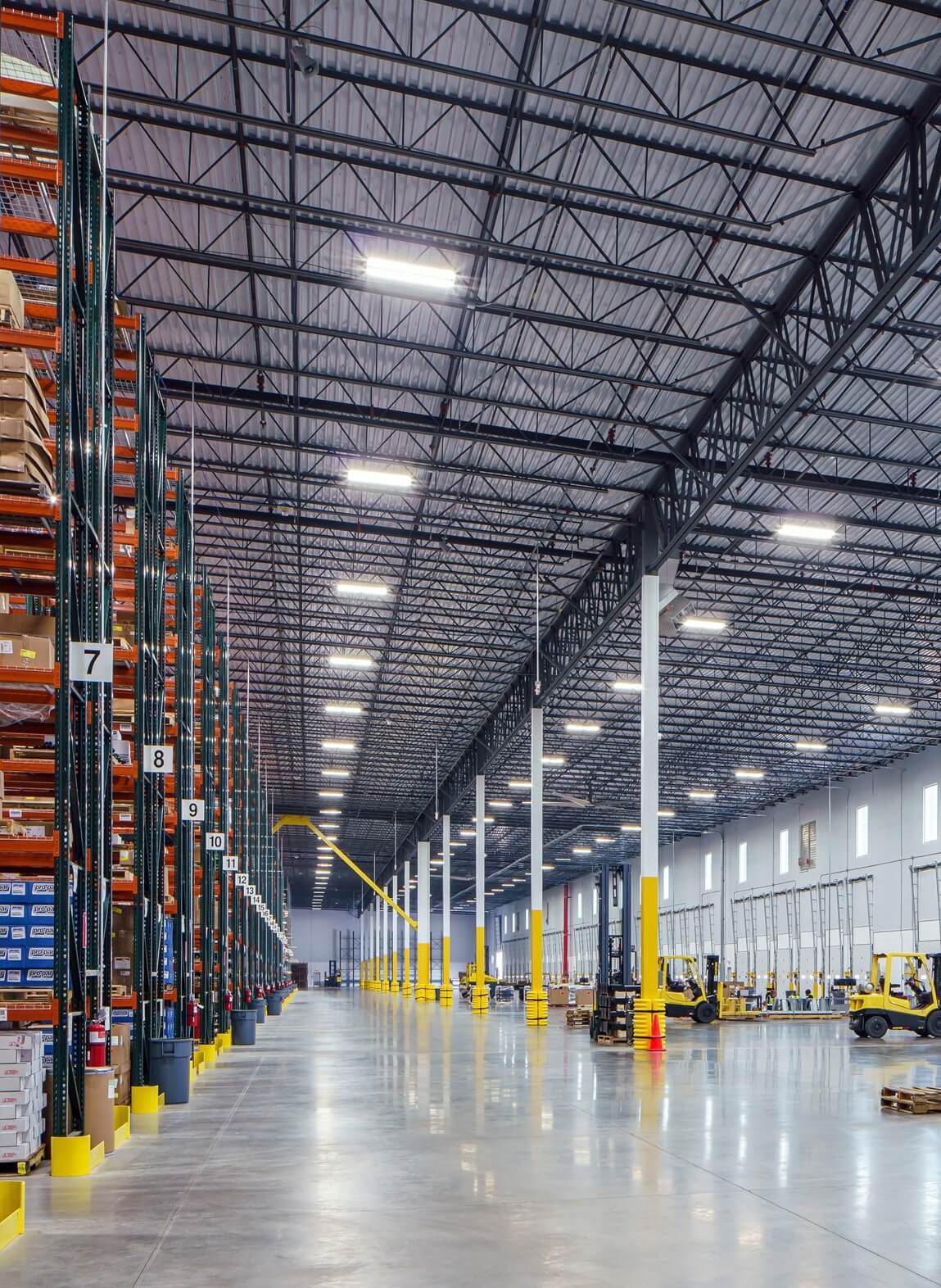 Interior Warehouse Floor View with Dock Doors and Racking